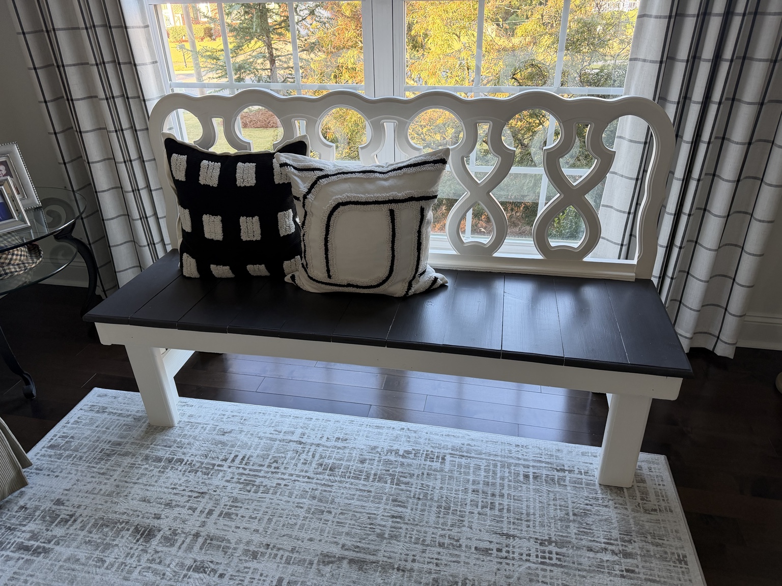 Before: the original dark seat and existing white frame.