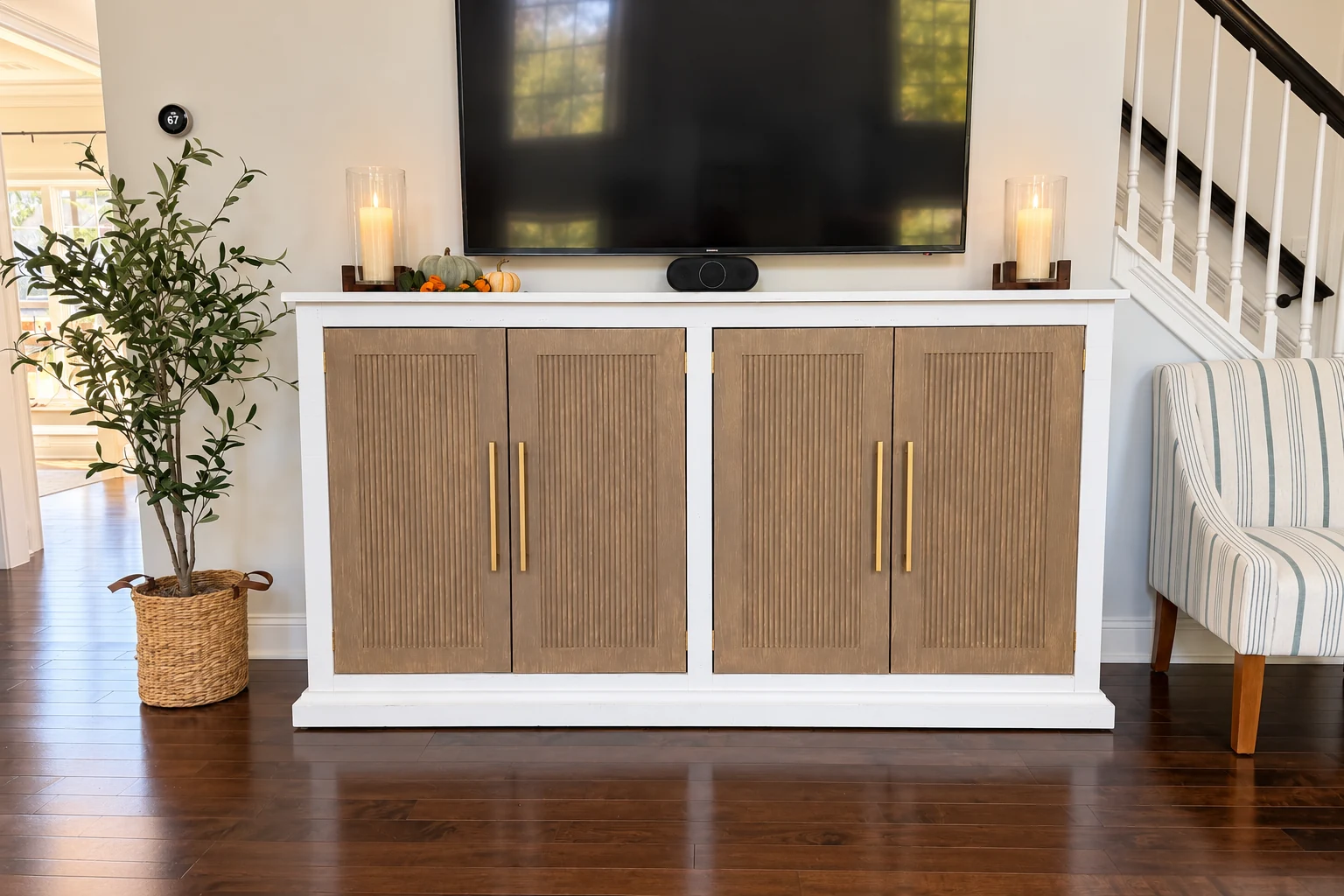 Finished fluted faux-white-oak credenza with brushed brass handles