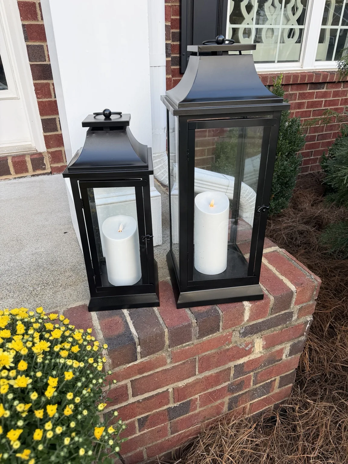 Finished black lanterns and refreshed white flameless candles