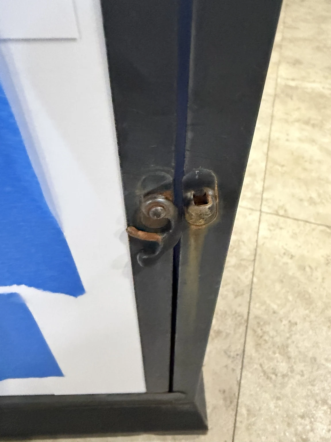 Close-up of rust on the original lantern latch before repainting