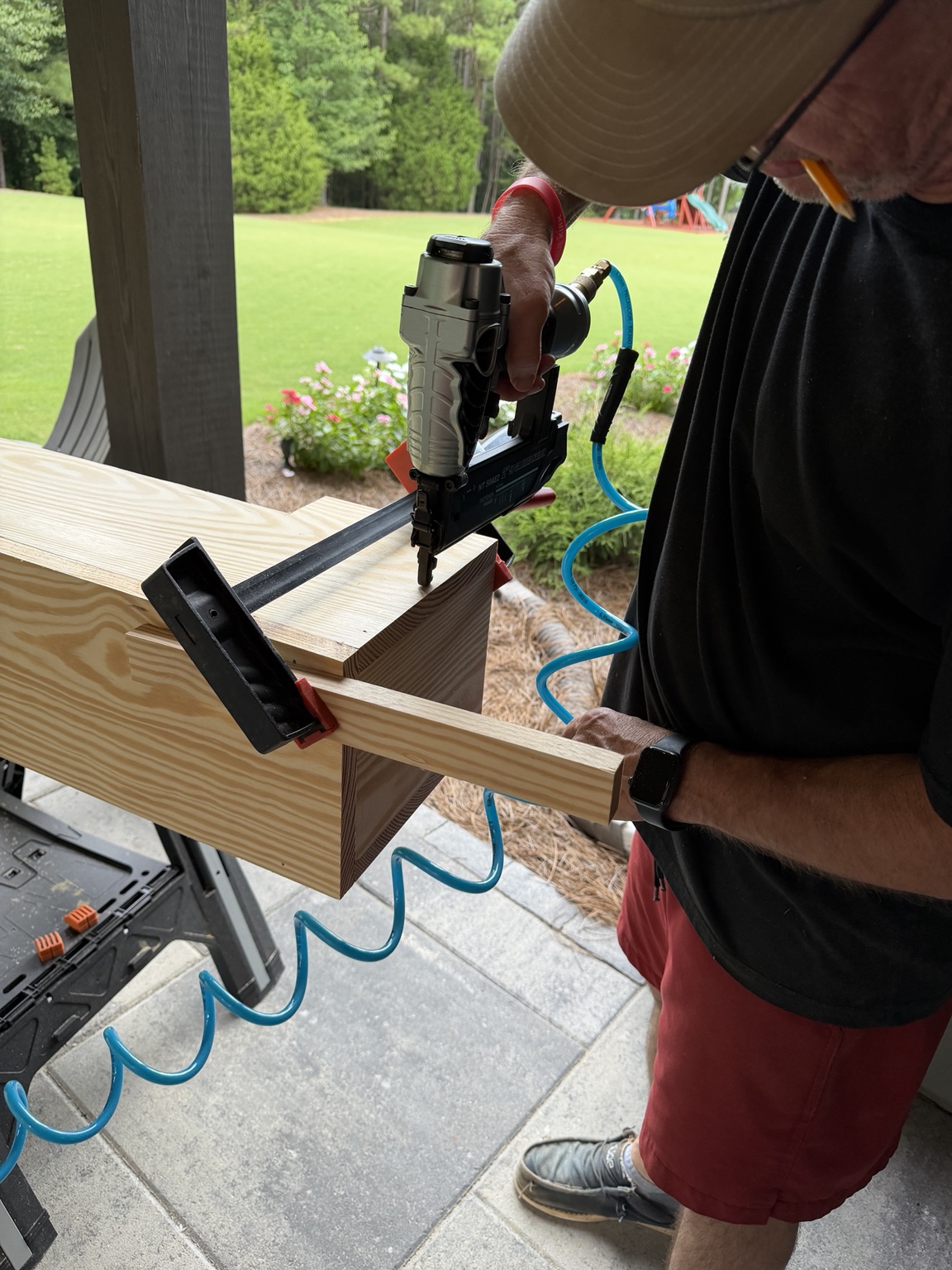 Using a brad nailer to assemble the pine mantel cover