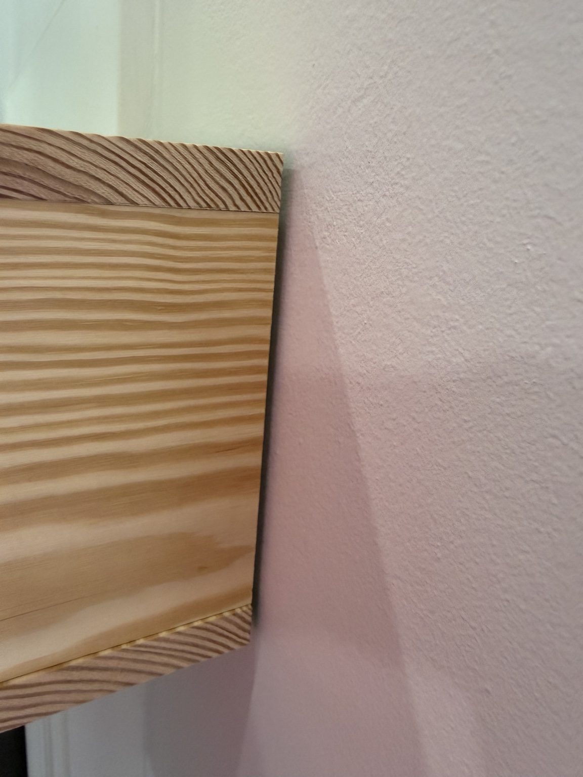 Close-up of the notch around the existing white mantel trim