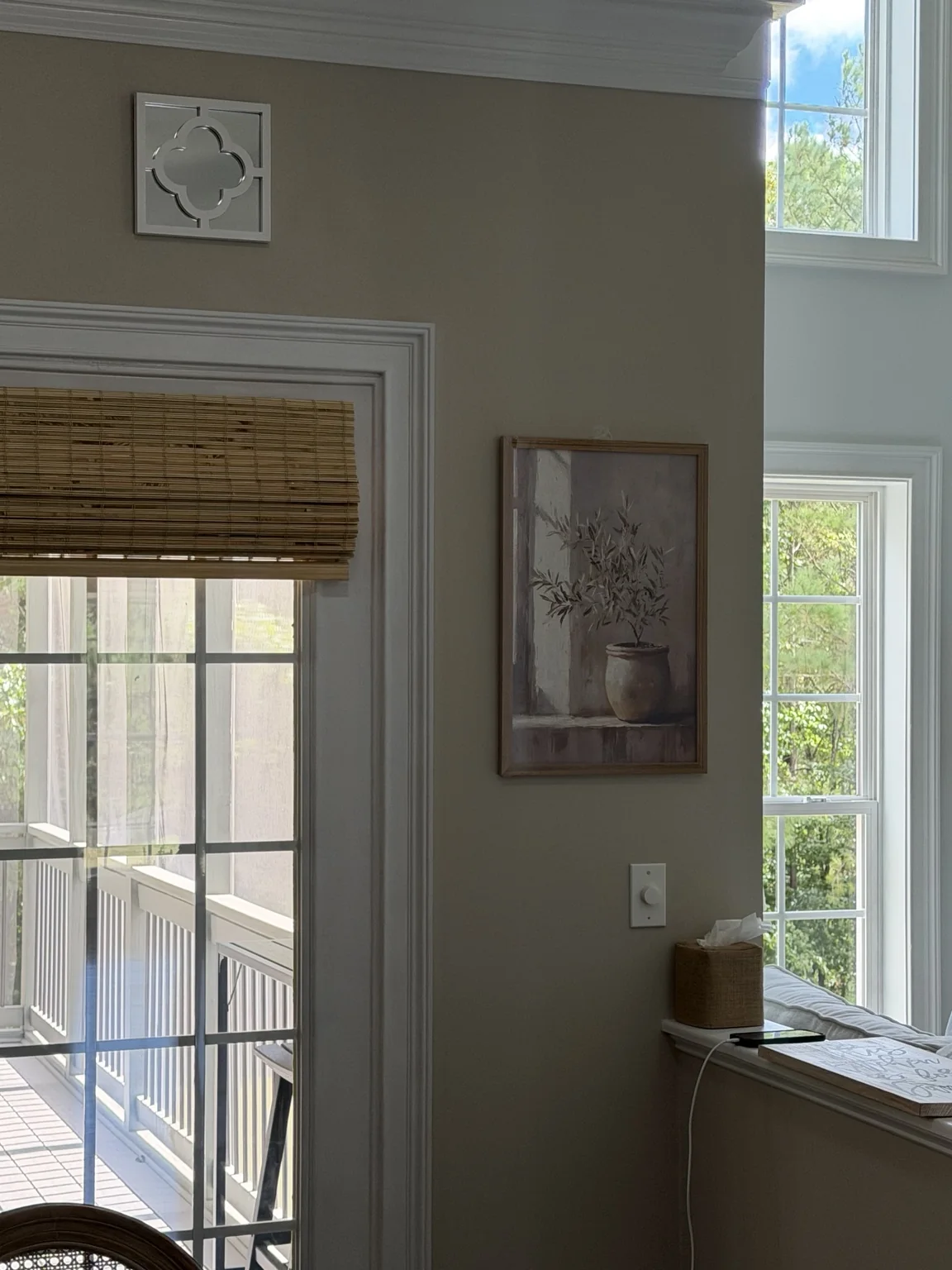 Bamboo shades above the French doors seen from the adjoining room
