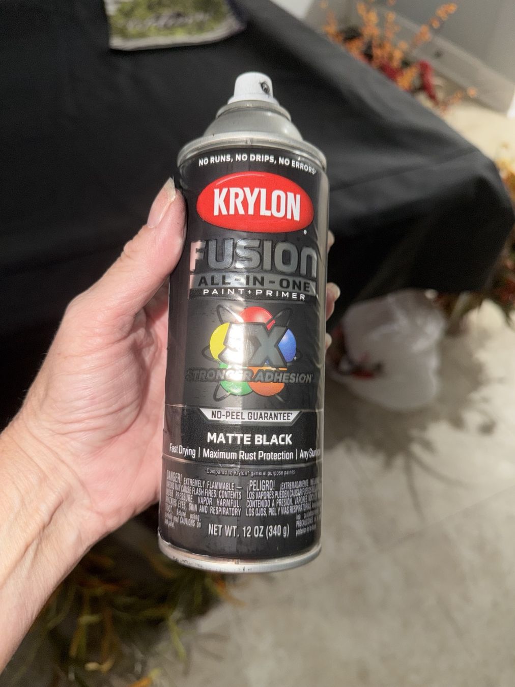 Painter’s tape protects the sides while the recess is sprayed matte black.