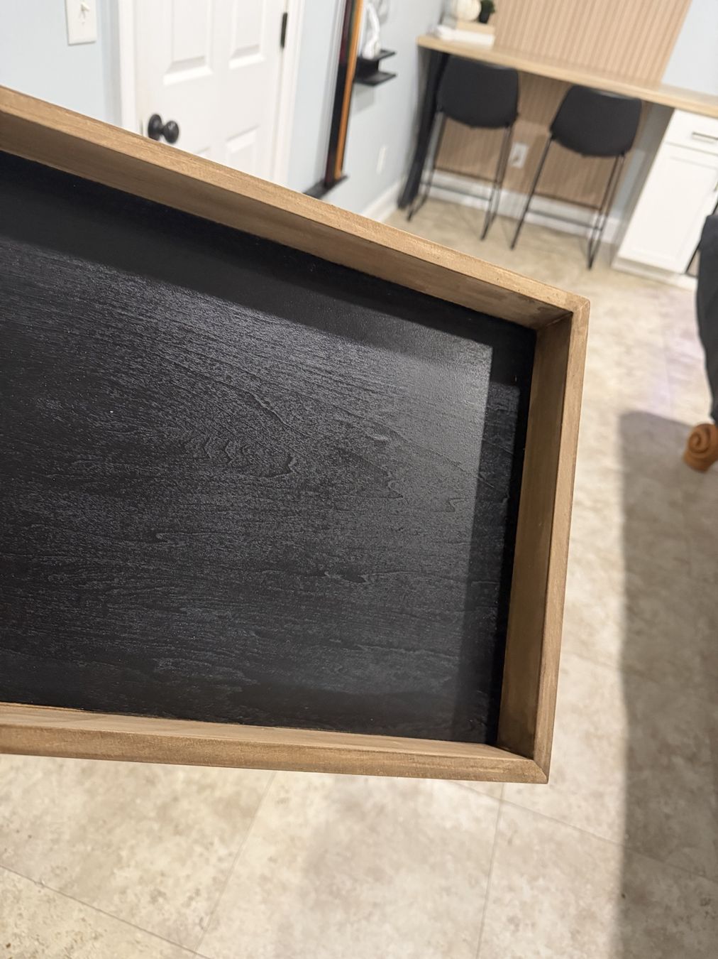 The completed contrast: stained wood around a matte-black recess.