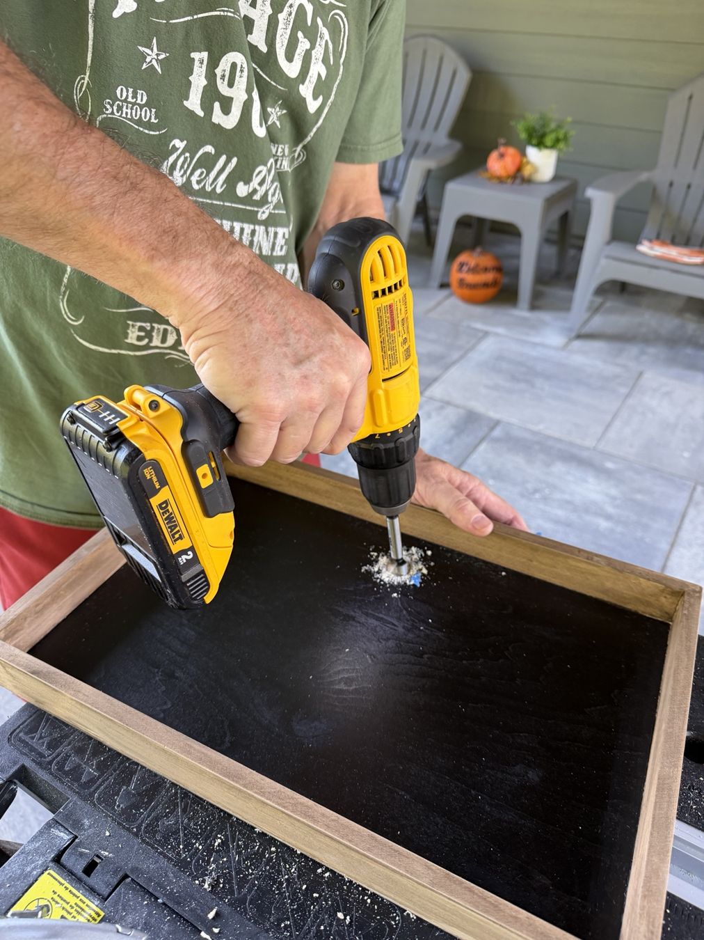 Drilling the panel to accommodate the device connections.